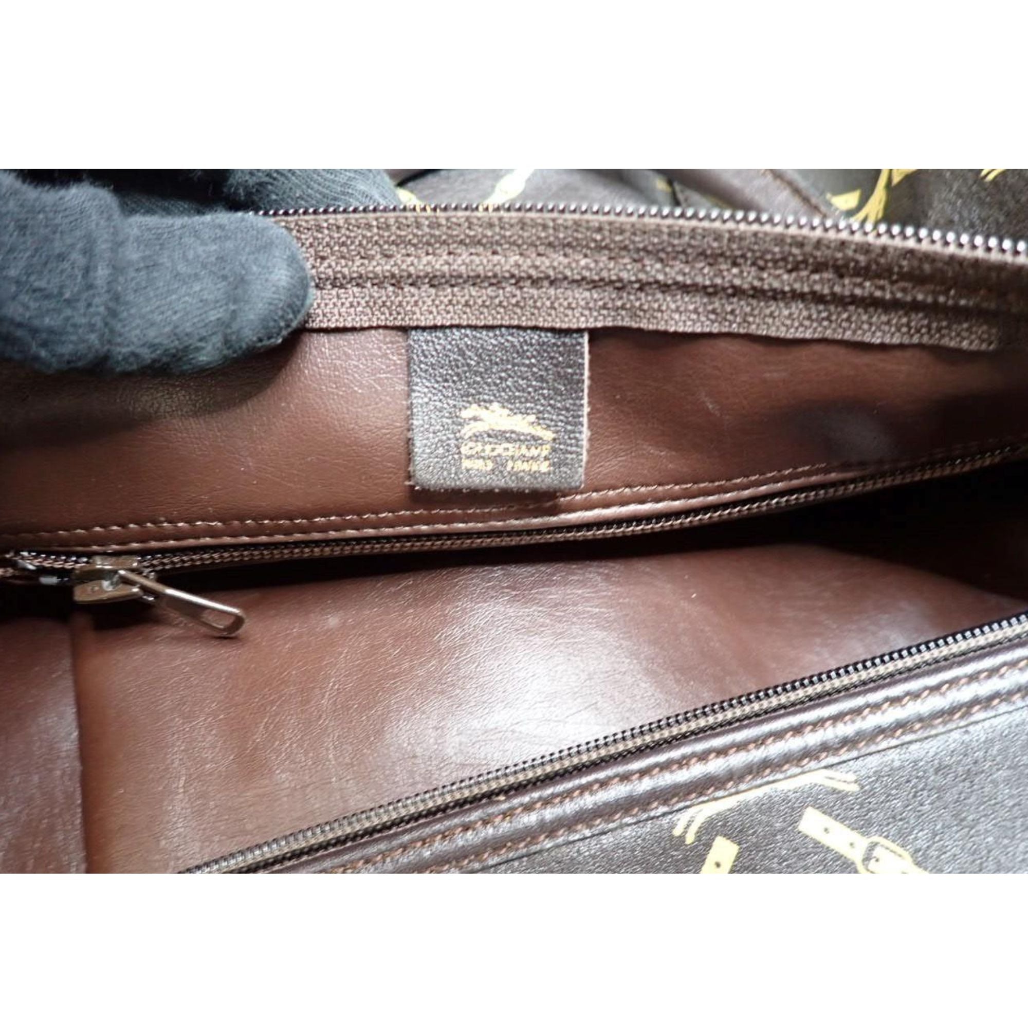 Longchamp Vintage Travel Bag en cuero marrón con estampado ecuestre