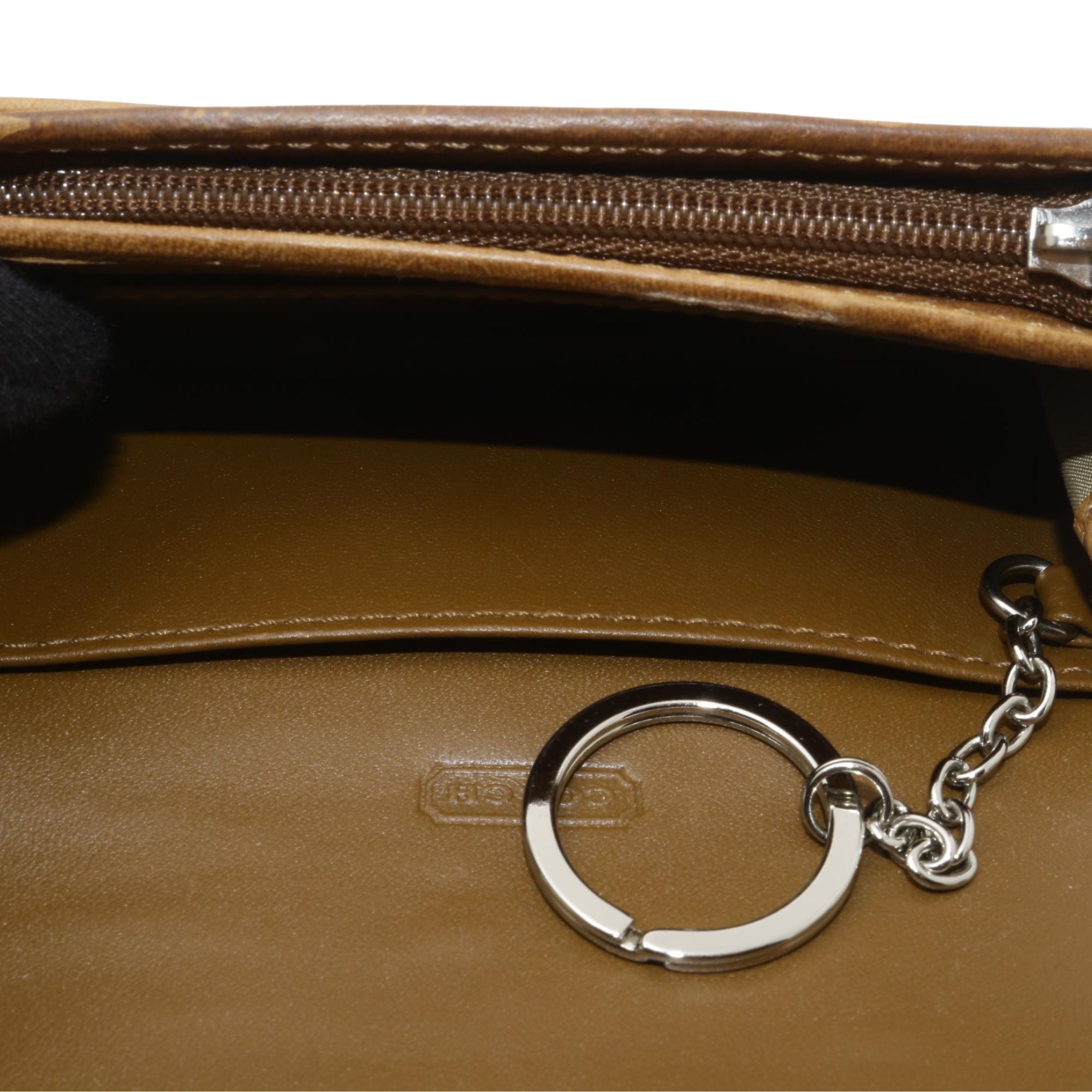 Cartera Coach patchwork multicolor con detalles en cuero y llavero interior