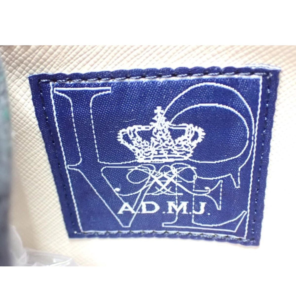A.D.M.J. – Clutch de piel negra granulada con bandolera desmontable | Made in Japan