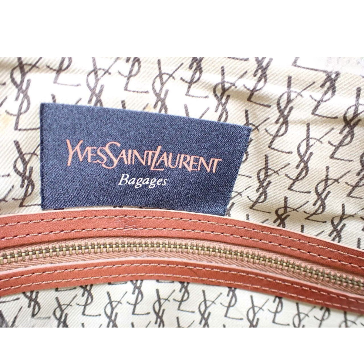 Yves Saint Laurent Bagages – Bolso de viaje vintage marrón coñac con piel perforada y cinco bolsillos