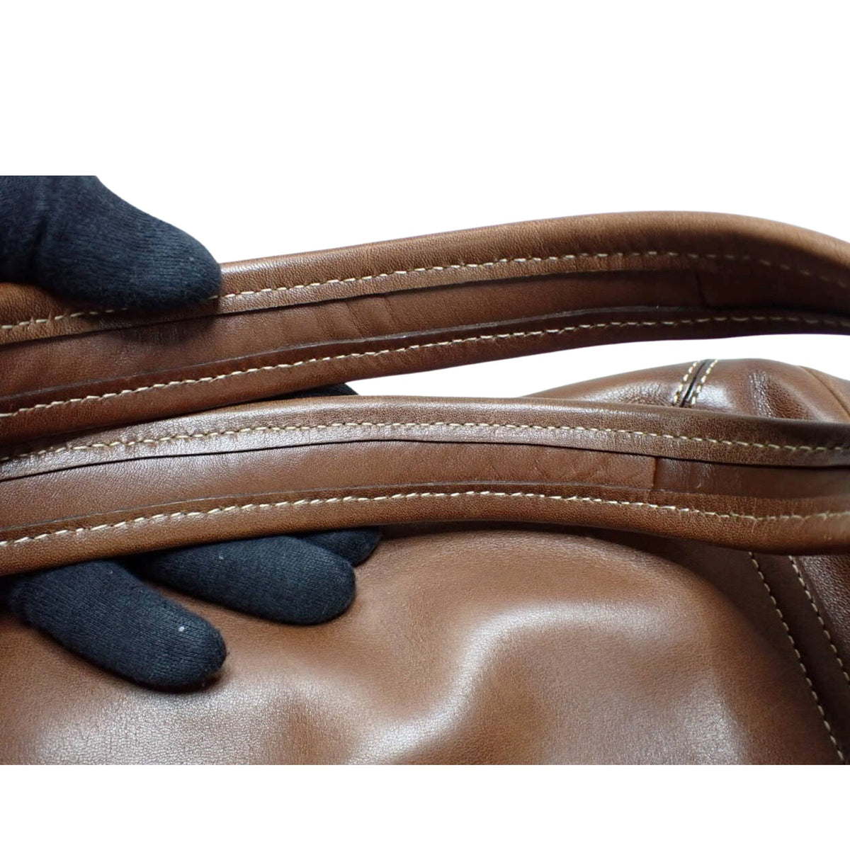 Coach – Bolso de hombro de piel marrón coñac con bolsillo frontal y forro multicolor